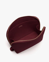 Open zippered pouch with inner label visible
