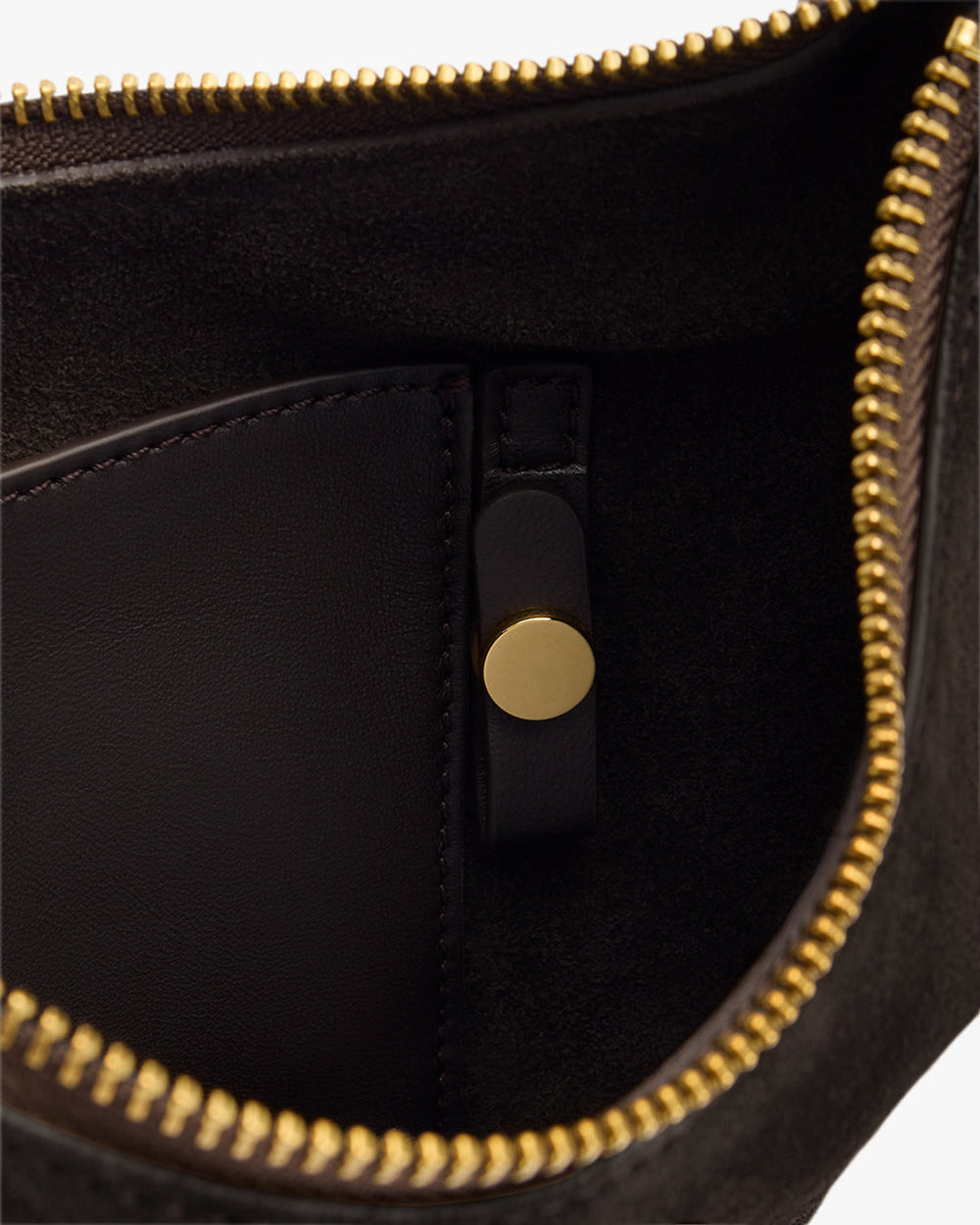 Open bag showing zipper, internal pocket, and a button.
