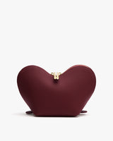 Heart-shaped pouch with a central zipper on a white background