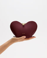 Heart-shaped pouch held in an open hand