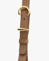 Leather strap with unique gold buckle design
