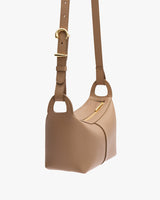 Shoulder handbag with a textured leather surface and adjustable strap.