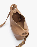 Open handbag with shoulder strap and visible interior pocket.