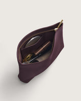 Open pouch with cosmetics inside