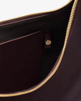 Open bag with visible inner pocket and zipper.