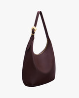 Shoulder bag with a rounded shape and adjustable strap