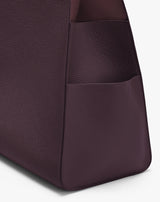 Close-up of a tote bag corner with a textured pocket