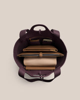 Top view of open handbag with organized contents inside