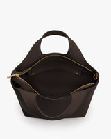 Open handbag with a round handle and a visible zippered inner pocket