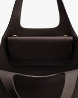 Open tote bag with interior pocket and two handles.