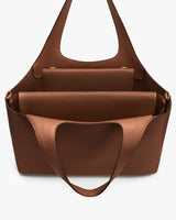 Open tote bag with interior pockets and handles.