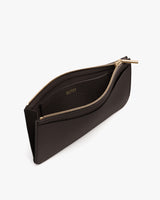 Slim pouch with a zipper and interior pocket, shown open.