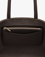 Open handbag with visible inner detachable zipper pouch.