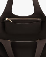 Open handbag with visible inner detachable zipper pouch.