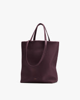 Tote bag with dual handles in a minimalist design.