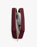 Open zippered pouch with electronic cords inside