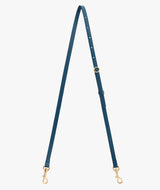 Long adjustable strap with clasps on each end shown on a plain background