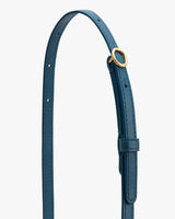 Bag strap with an adjustable buckle and multiple holes