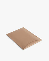 Foldable square pouch on a plain background