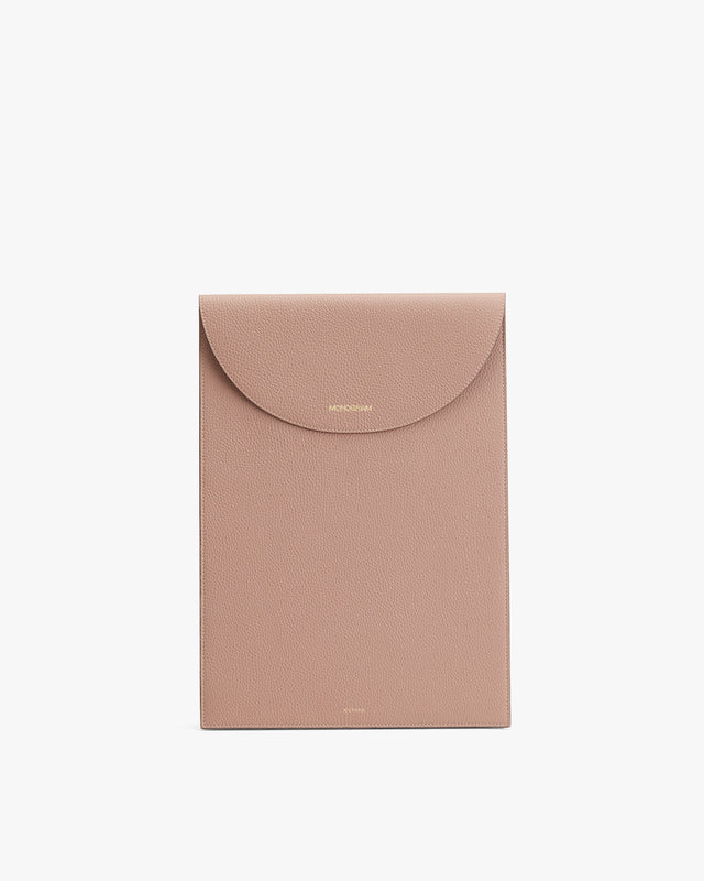 Envelope-shaped clutch bag with a flap closure and brand logo embossed on the front.