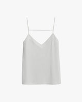 Women's tank top with thin straps and V-neckline, hanging on a hanger.