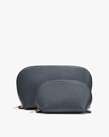 Two cosmetic bags in different sizes positioned against a plain background.