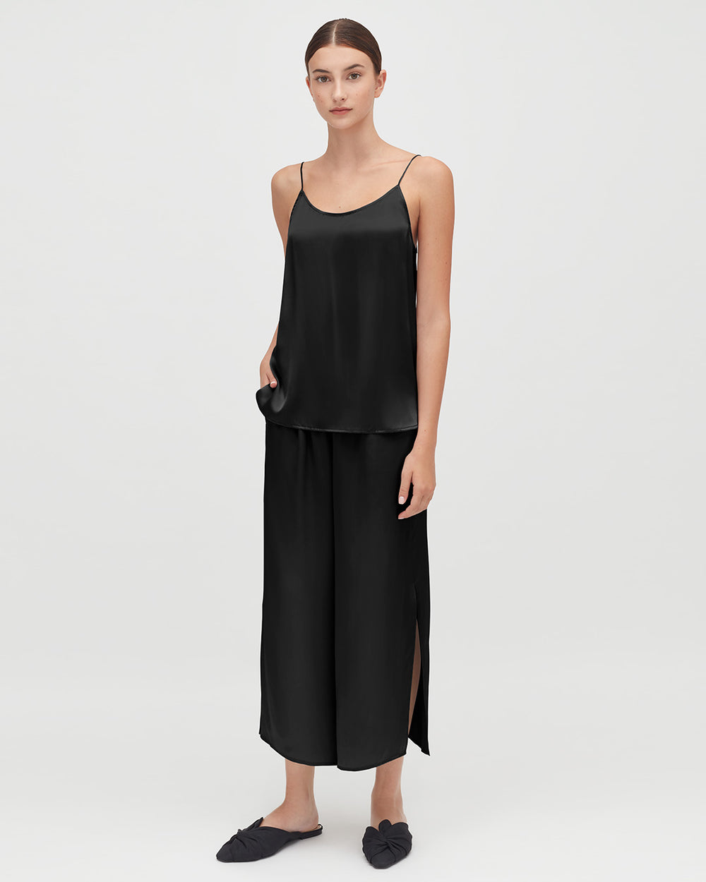 Washable Charmeuse Cropped Wide-Leg Pant Woman standing in a sleeveless top and pants with slits