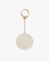 Keychain with a circular tag and metal ring, branded logo visible.