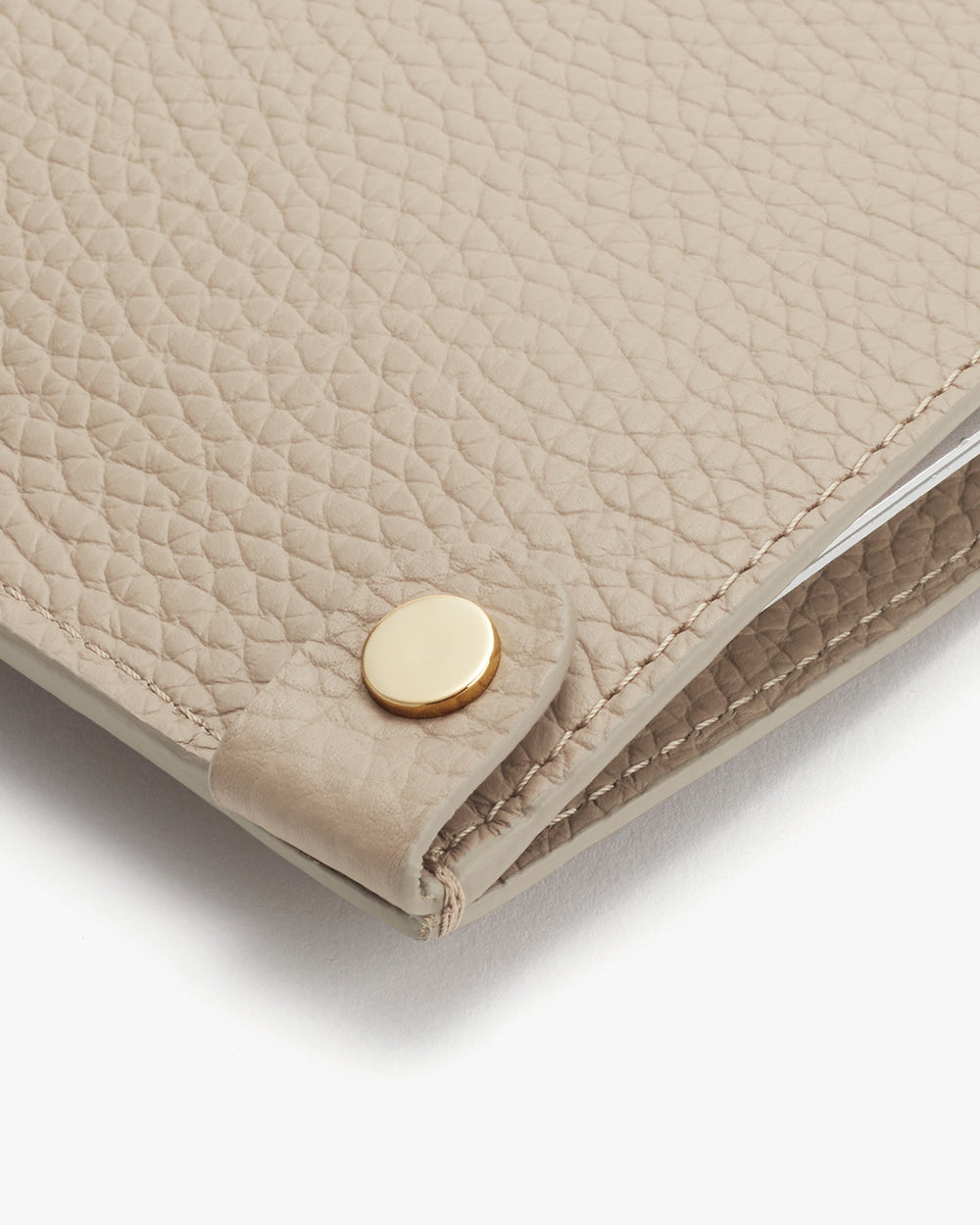System Laptop Sleeve 13-inch Close-up of a textured clutch with a metallic clasp