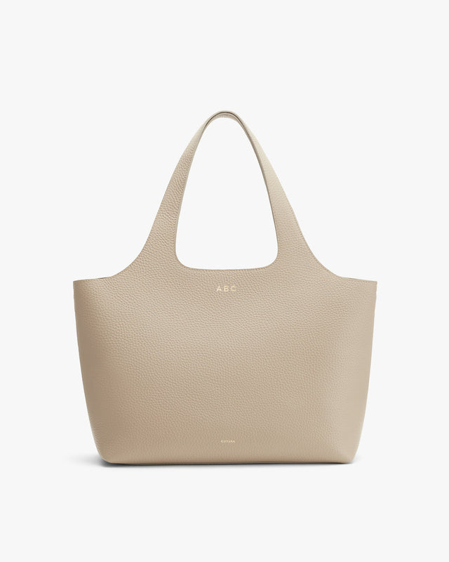 Monogrammed tote bag with two handles.