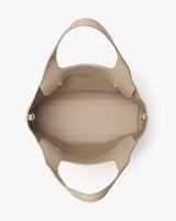 Open handbag viewed from above showing interior and handles.