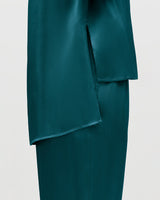 Close-up of a skirt with an overlapping front panel.