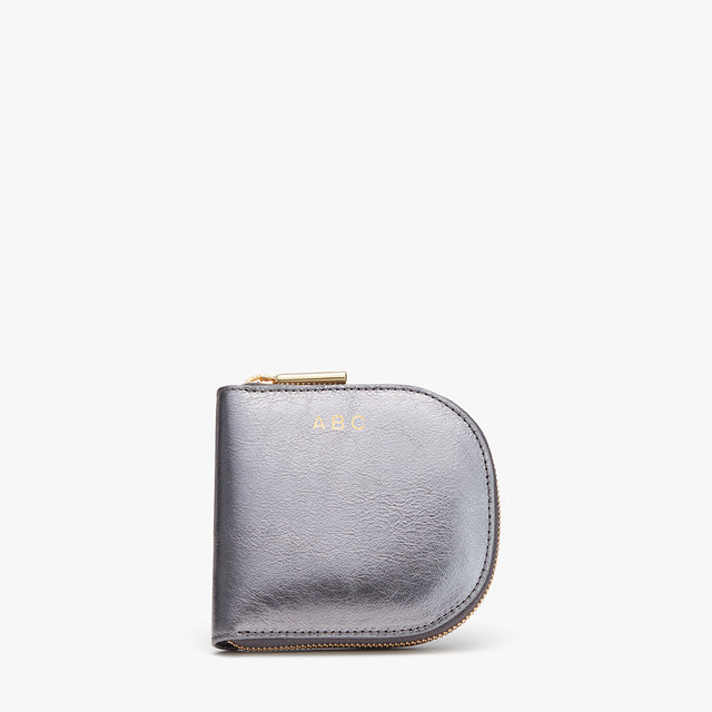 Small zipper wallet with monogram initials on it.