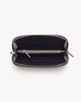 Open small rectangular bag with zippers viewed from above.