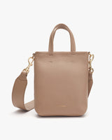 Handbag with handles and a detachable shoulder strap.