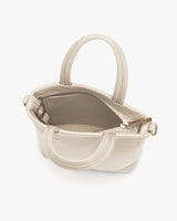 Small handbag with open zipper visible.