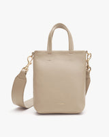 Handbag with top handle and detachable shoulder strap.