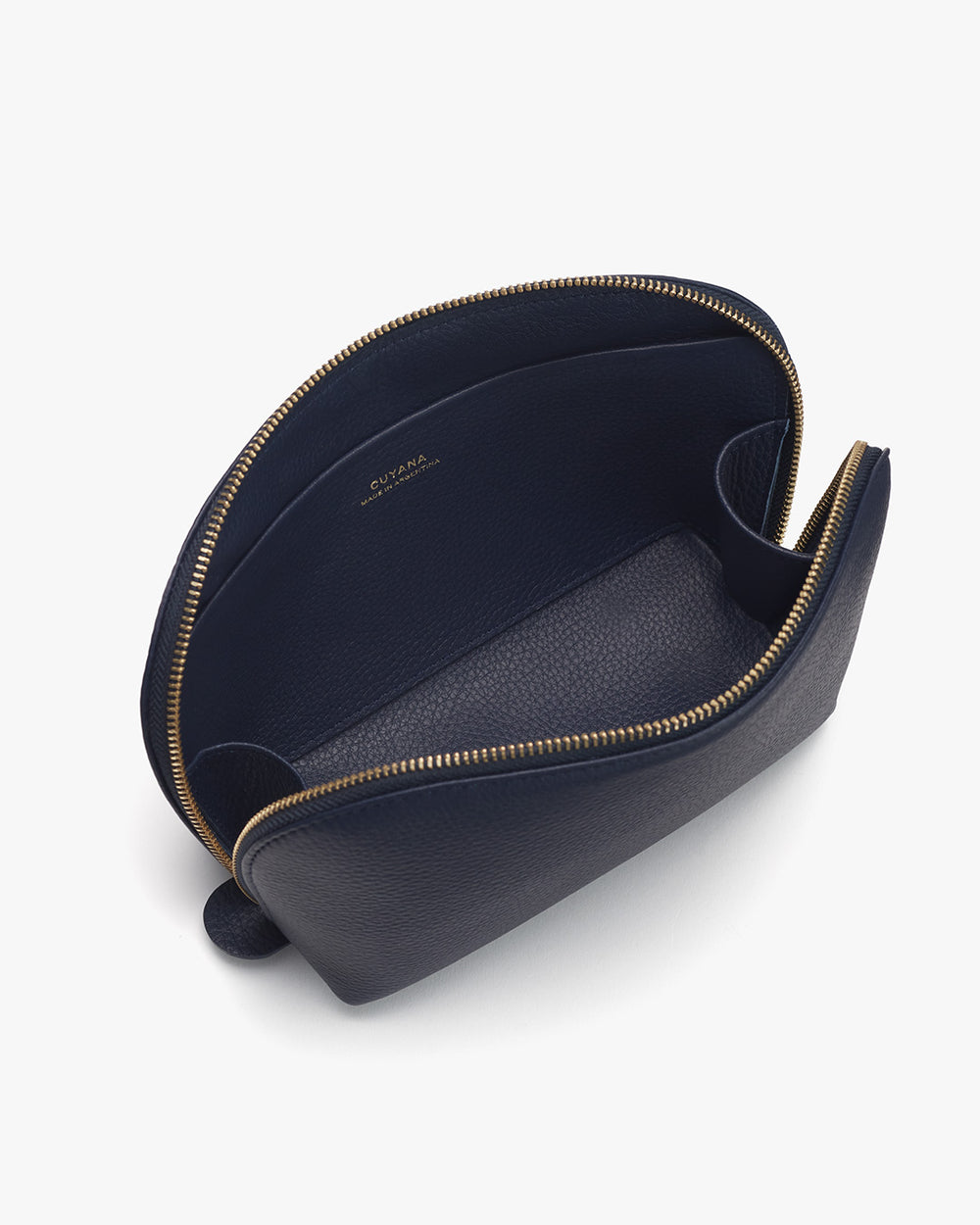 Open navy blue clutch bag with gold zipper on white background.