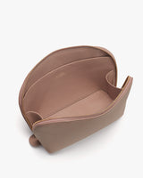 Open zippered pouch on plain background.