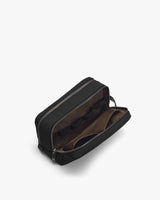 Open toiletry bag with two compartments visible.