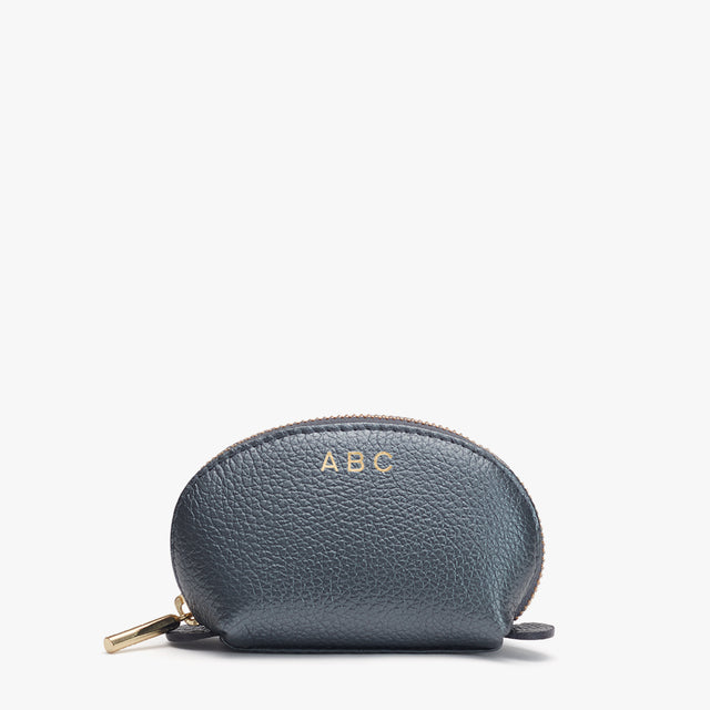 Small zippered pouch with initials ABC on front.