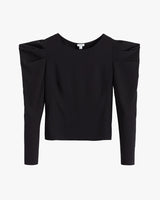 Long-sleeve top with shoulder pads displayed against a plain background.