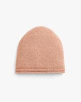 Knit beanie on a plain background.