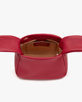 Open handbag with visible interior branding.