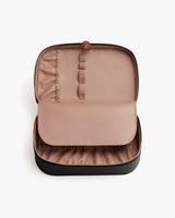 Open travel case with compartments inside.