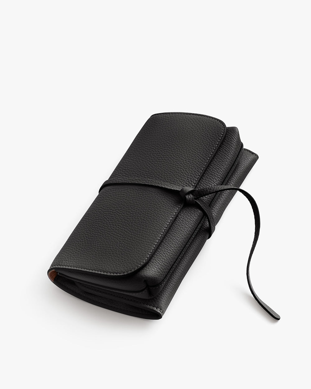 Closed black wallet with a wrap-around tie on a light background.