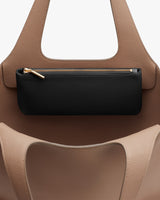 Handbag with a small pouch attached to the handle.