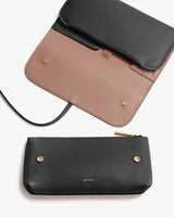 Three purses displayed, two with flaps and shoulder straps, one zippered.