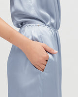 Person with hand in pocket of a dress