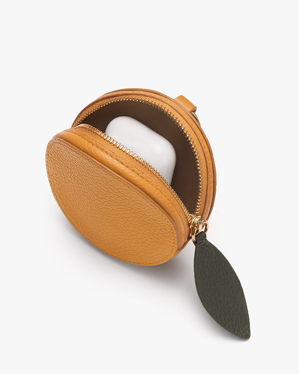 Clementine Pouch Round pouch with zipper and leaf-shaped keychain attachment.